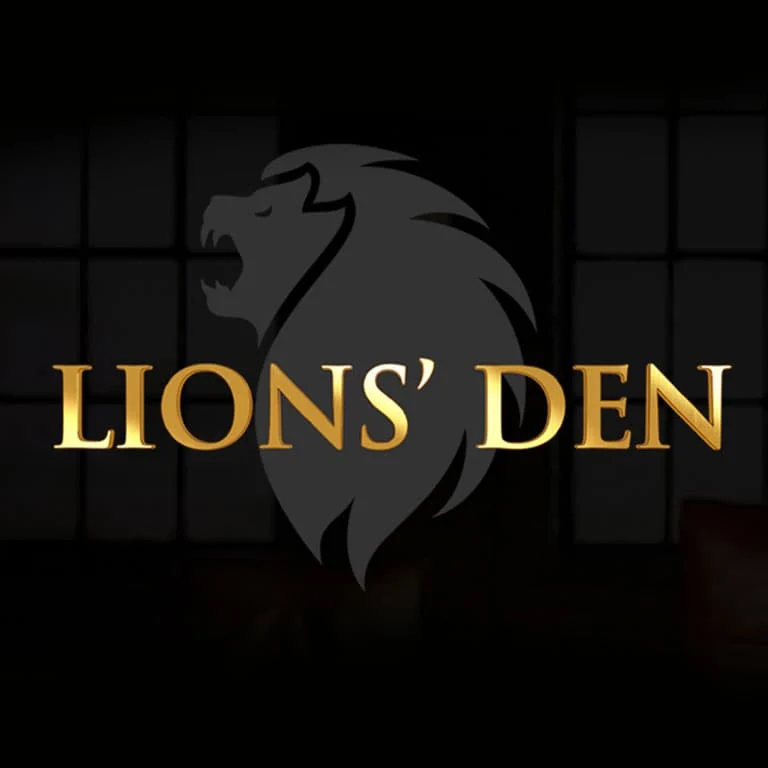 Lions’ Den logo: a gold lion emblem above the words LIONS’ DEN on black